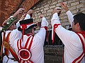 Supplying beer to the captive Morris Men in the Watch House
